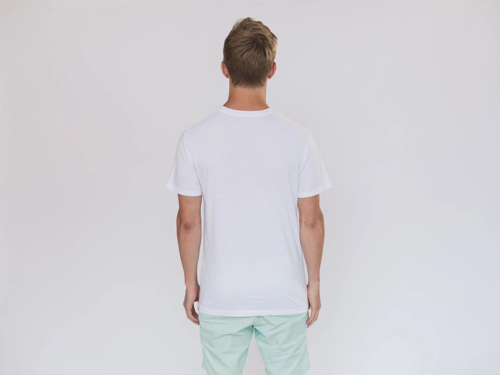 Back view of a model in a plain white tee against a light grey studio wall
